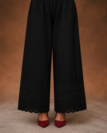 Black soft cotton trousers with intricate chicken embroidery work and scalloped lace detailing along the hem, stylish comfortable women’s trousers, all sizes available.