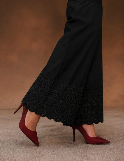 Black soft cotton trousers with intricate chicken embroidery work and scalloped lace detailing along the hem, stylish comfortable women’s trousers, all sizes available.