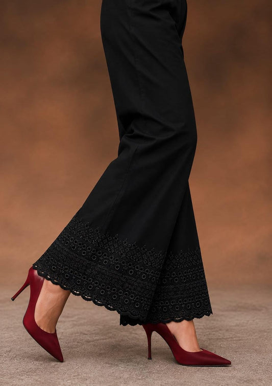 Black soft cotton trousers with intricate chicken embroidery work and scalloped lace detailing along the hem, stylish comfortable women’s trousers, all sizes available.