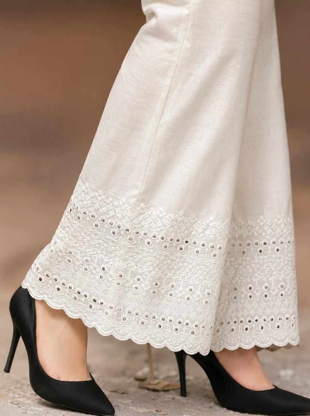  white soft cotton trousers with intricate chicken embroidery work and scalloped lace detailing along the hem, stylish comfortable women’s trousers, all sizes available.