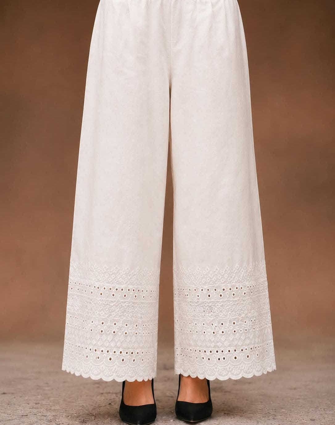  white soft cotton trousers with intricate chicken embroidery work and scalloped lace detailing along the hem, stylish comfortable women’s trousers, all sizes available.