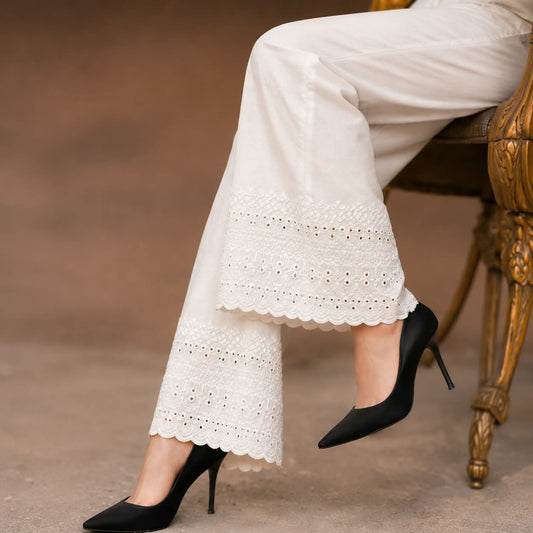  white soft cotton trousers with intricate chicken embroidery work and scalloped lace detailing along the hem, stylish comfortable women’s trousers, all sizes available.