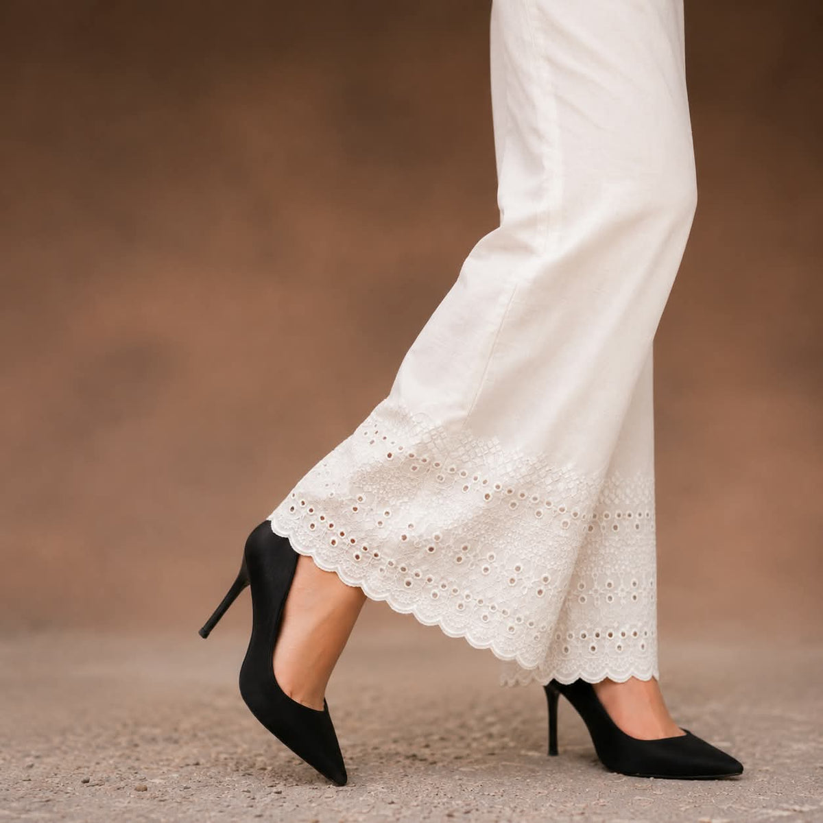  white soft cotton trousers with intricate chicken embroidery work and scalloped lace detailing along the hem, stylish comfortable women’s trousers, all sizes available.